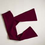 Bamboo flares navy flare leggings in burgundy, folded flat lay on a neutral surface.