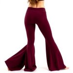 Back view of a model wearing navy bamboo flares in Burgundy, showcasing the fit from behind.