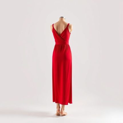 A woman wearing the red First Muse dress for shoulder yoga on a white background.