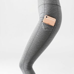 Flare leggings woman in Heather Grey with phone pocket, hyperrealistic studio photo on white background.