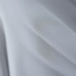 Close-up detail of the Luna 3 flare stretch pants showing fabric texture and stitching.