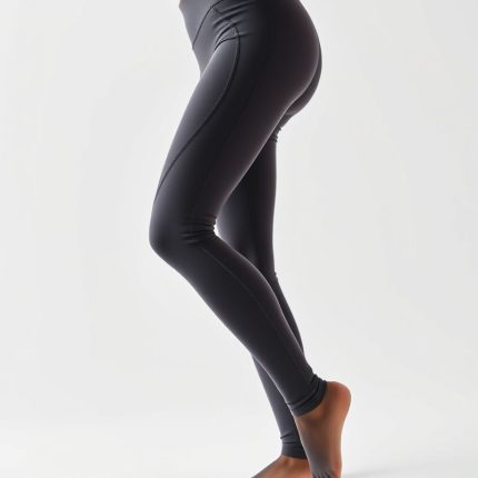 High waisted yoga pants in charcoal colour on white background, hyperrealistic studio photo.