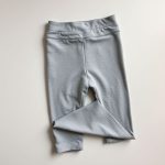 High waisted yoga pants in Heather Grey, organic cotton leggings folded flat lay.