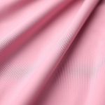 Close-up detail of raspberry leaf te hot yoga pants fabric texture and stitching.