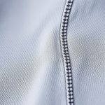 Close-up of the soft, breathable organic activewear cotton yoga pants fabric and stitching.