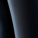 Close-up of the organic cotton yoga pants fabric showing moisture-wicking texture and quality stitching.