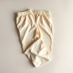 Organic cotton yoga pants flare lounge pants in Beige, folded flat lay.