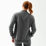 Back view of a model wearing pink yoga pants and an organic cotton cardigan in Heather Grey.