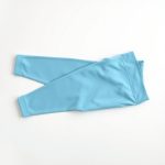 Sky Blue white yoga leggings by indi clothing, neatly folded in a flat lay.