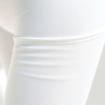 Close-up of white yoga pants seamless pocket leggings showing recycled fabric texture and quality stitching.