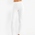 White workout pants with pockets and scrunch bum detail on a white studio background.