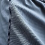 Close-up of high-quality fabric and stitching on yoga shorts men, showcasing material detail in yoga mens clothing.